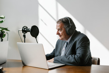 Businessman recording a podcast