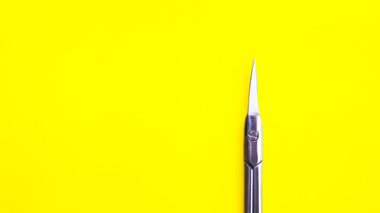 Manicure tool on a yellow background.