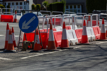 Safety cones and barriers placed to indicate access to road lanes for motorists in the UK
