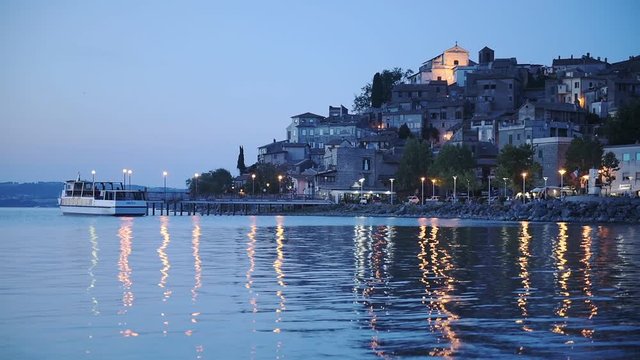 Panoramic view of Bracciano town and Lake Bracciano, Italy, at night