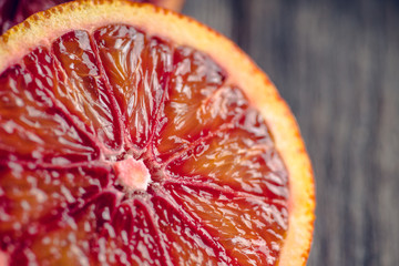 Ripe bloody oranges on the rustic background. Selective focus. Shallow depth of field.
