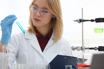 Technician hold in arms in protective gloves sample bottle with poison fluid portrait. Medical worker in uniform use reagent tube for virus infection exam or biological toxic reaction drug creation