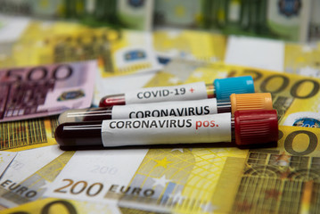 Euro banknote and positive test at coronavirus