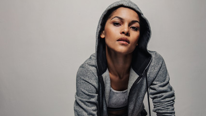 Fitness woman in a hoodie jacket
