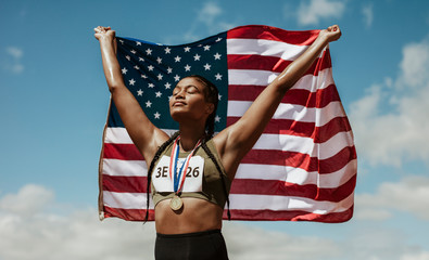 Proud female athlete with USA flag