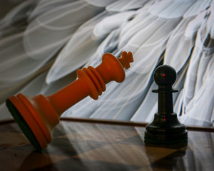 chess pieces on the board. King falling