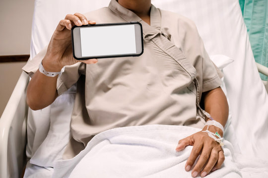 Patient showing  the monitor of smartphone in hospital