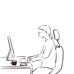 パソコンデスクに向かって仕事をする女性２