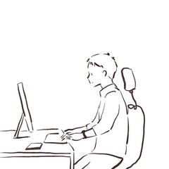 パソコンデスクに向かって仕事をする男性