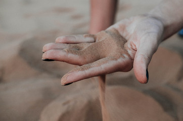 sand falls from my hands