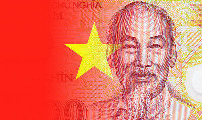Close-up portrait of Ho Chi Minh and national red flag on the Vietnamese Banknote, Vietnam paper...