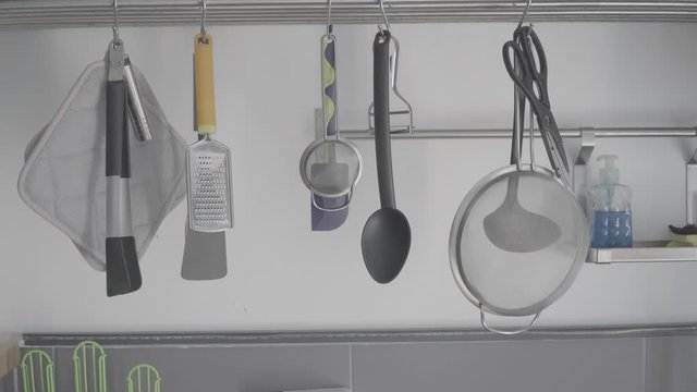 Kitchen Tools Hanging On A Restaurant Long Shot