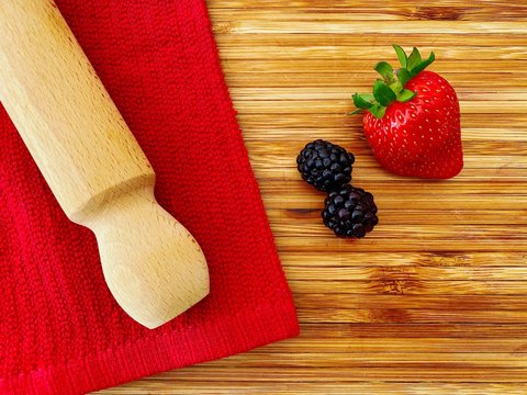 Strawberries And Blackberries On A Wooden Kitchen Counter. Ingredients For Baking A Summer Berry, Strawberry And Blackberry, Pie Or Tart. Top Down Flat Lay View. Red And Summery Food Flat Lay