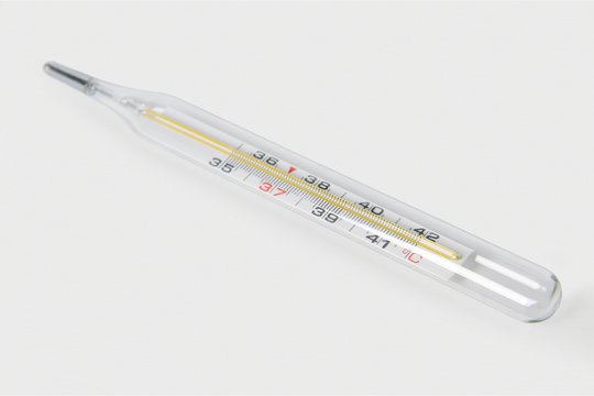 Classic Medical glass mercury thermometer for measuring body temperature isolated on a white background. Сlose-up photo
