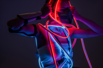 futuristic african american woman in respirator and neon lighting © LIGHTFIELD STUDIOS