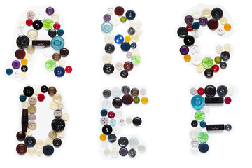 Buttons from clothes in the form of letters of the English alphabet