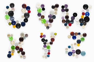 Miscellaneous colored buttons in the form of letters of the alphabet