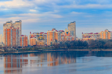 Obraz premium View of Obolon embankment of the Dnieper river and church of the Nativity of Christ in Kiev, Ukraine