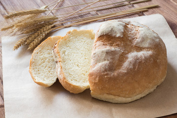 village bread with koes on paper on table