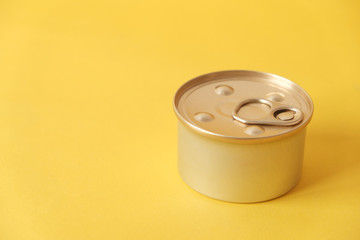 Canned food closed on yellow background. Copy, empty space for text