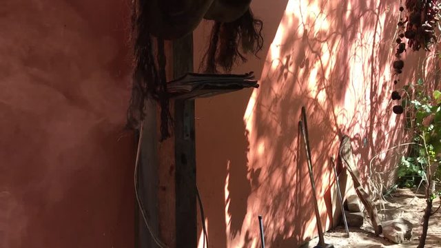 Smoke coming out of a molcajete in a Mexican handcrafting workshop.