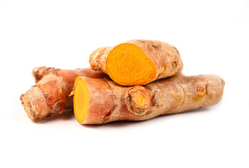 Close up of cutting of turmeric roots on white background, Herbs