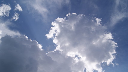 fluffy white clouds in the blue sky