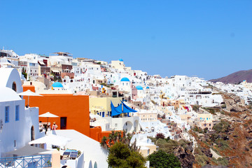 Fototapeta premium Beautiful Santorini view in Greece. Blue sea and white buildings. Santorini Island, Greece.