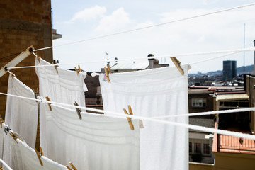 White clothes drying on a clothesline during a sunny day.