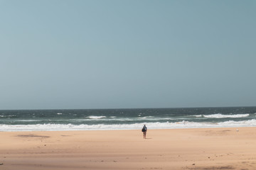man walking on the beach