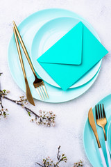 Spring table setting with envelope