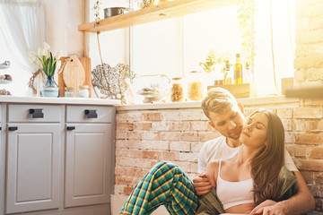 Relaxed longhaired girl leaning on her husband