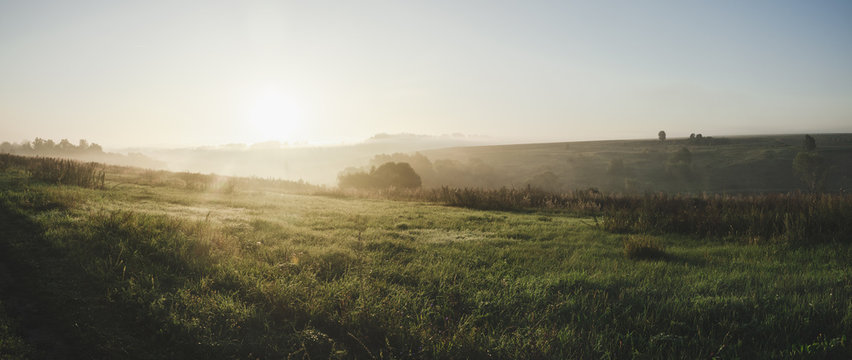 Majestic Sunrise Over Green Hills.