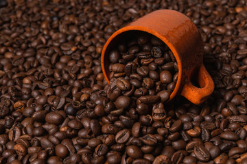 close up of coffee mug on coffee beans