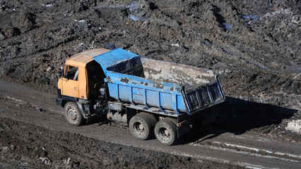 Tractors and excavators work on the construction of the foundation zero cycle