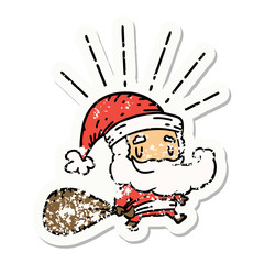 grunge sticker of tattoo style santa claus christmas character with sack