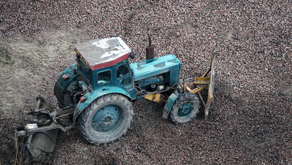 Tractors and excavators work on the construction of the foundation zero cycle