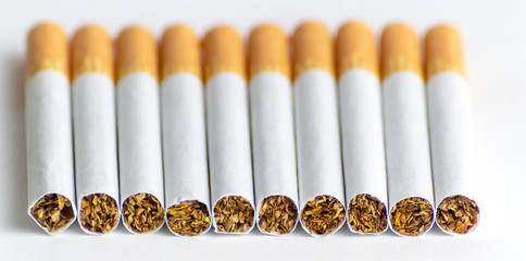 Cigarettes on a white background, tobacco is not a game
