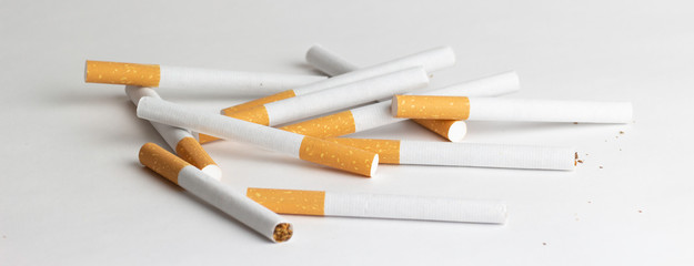 Cigarettes on a white background, tobacco is not a game