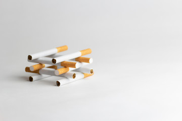 Cigarettes on a white background, tobacco is not a game