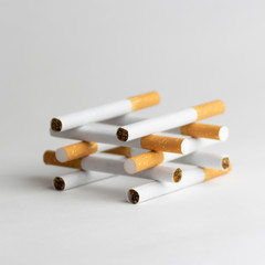 Cigarettes on a white background, tobacco is not a game