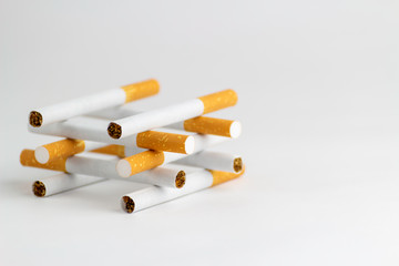 Cigarettes on a white background, tobacco is not a game