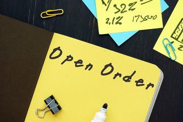 The photo says Open Order. Notepad, pen, marker.