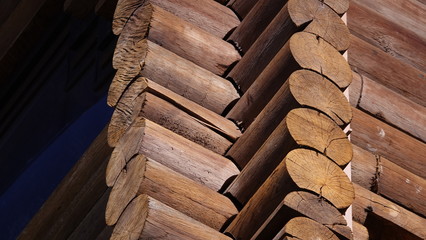 House made of wooden logs corner laying background