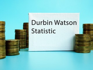 The photo says Durbin Watson Statistic. Notepad, pen, marker.