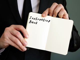 The photo says Instructing Bank. Notepad, pen, marker.