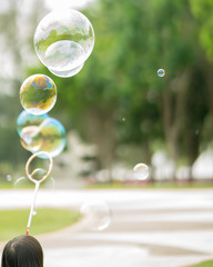 Close up Soap bubbles floating in the garden park.(Selective focus)