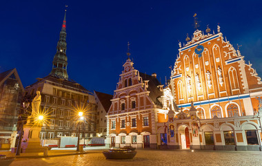 City Hall Square with House of the Blackheads in Old Town of Riga at night.