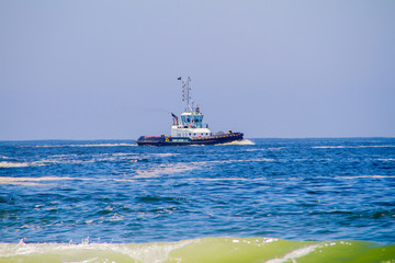 tugboat sailing in the sea of copacabana in rio de janeiro