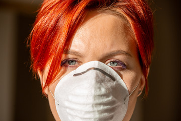 face of a woman in medical face mask